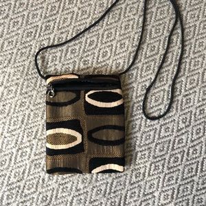 Beautiful small crossbody bag.  Black and gold fabric 6”x 7.5
